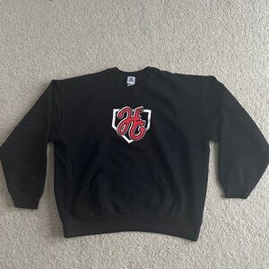 Classic Black Crewneck Sweater with Red Emblem